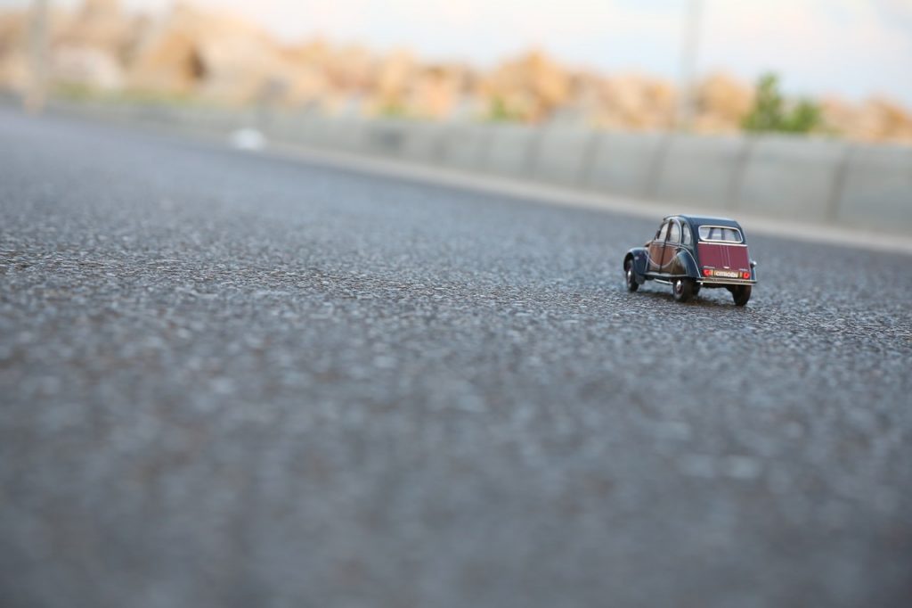 toy car on asphalt driveway