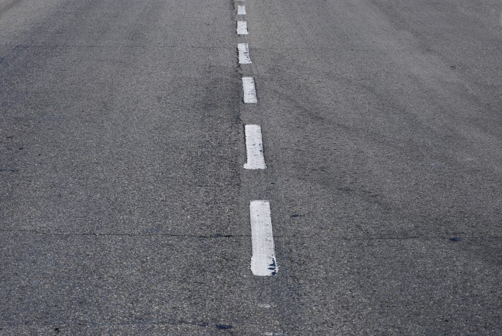 Asphalt road with lines. Travel and transportation.