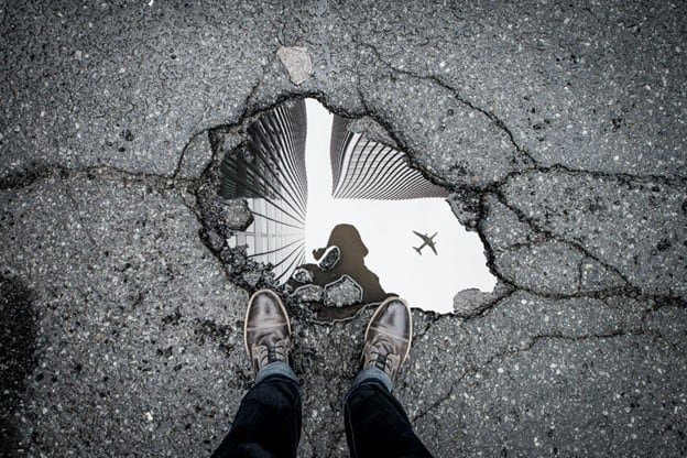 Looking down on a hole in pavement