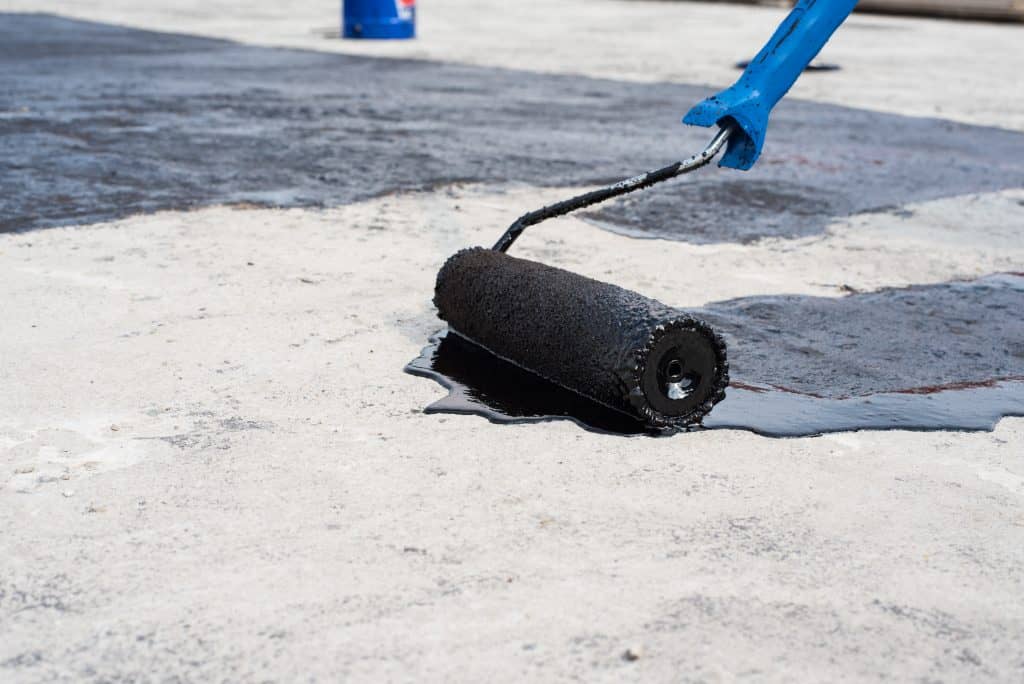 Worker Seal Coating surface