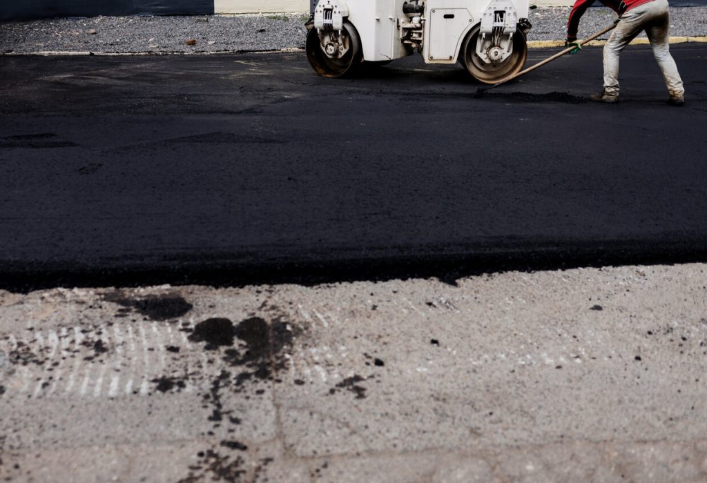 Asphalt driveway being paved.