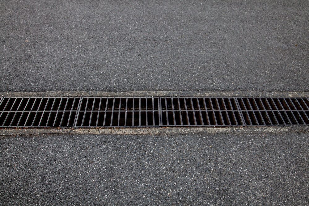 Drainage in Asphalt Longevity. Steel Drainage Of The Asphalt Road.